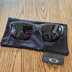Oakley Men’s Clear Frame with Black Lenses Sunglasses